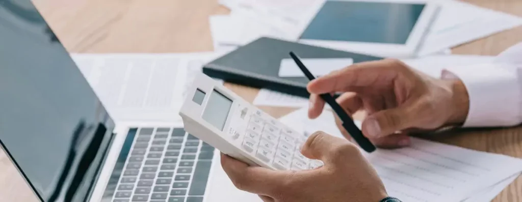 businessman using calculator in office